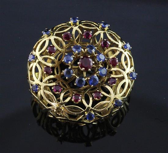 A French 18ct gold, ruby and sapphire set clip brooch by Mellerio, Paris, gross 25 grams.